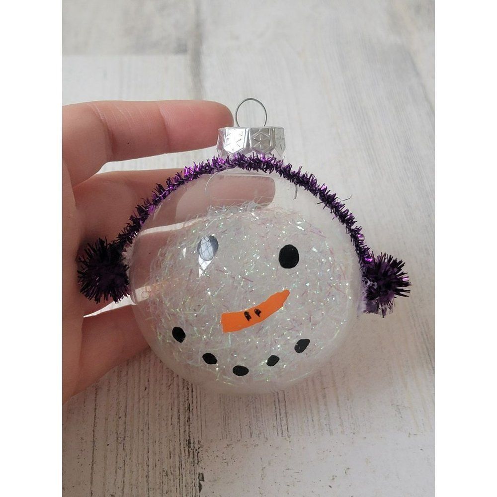 Snowman face ball ornament purple earmuffs Xmas decor